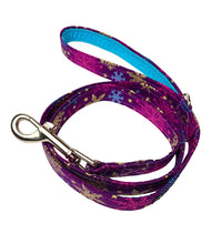 Christmas Snowflakes dog lead made from a purple cotton printed with gold, purple and turquoise snowflakes. Handmade and washable.