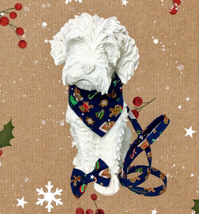 Dog mannequin wearing Gingerbread Village dog bow tie in navy cotton poplin.  Handmade in the UK and washable 