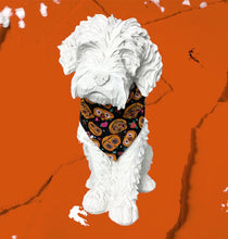 Halloween pumpkin dog bandana made from soft cotton poplin. Beautifully printed with scary pumpkin faces. Handmade in the UK. Washable