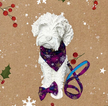 Dog mannequin wearing the Christmas Snowflakes dog bow tie made from a purple cotton printed with gold, purple and turquoise snowflakes. Handmade and washable.