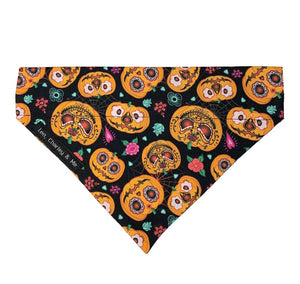 Halloween pumpkin dog bandana made from soft cotton poplin. Beautifully printed with scary pumpkin faces. Handmade in the UK. Washable 