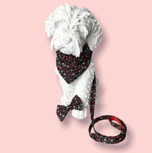 Dog mannequin wearing a red and cream floral print bandana, collar and lead. Hand made in the UK and washable 
