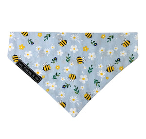 Bee and daisy print dog bandana in baby blue.  Handmade in the UK and washable. Matching accessories are available for owners too. 