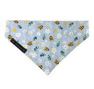 Bee and daisy print dog bandana in baby blue.  Handmade in the UK and washable. Matching accessories are available for owners too.