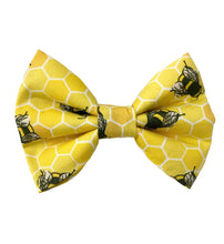 Handmade bright yellow honeycomb and bee print dog bow tie. Made in the UK and washable.