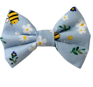 Cute handmade bee and daisy print  dog bow tie. Handmade in the UK and washable. Matching accessories available for owners. 