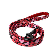 Beautiful heart print dog lead with matte blank hardware. Made in the U.K.