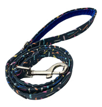 Confetti print dog lead with vibrant blue velvet handle lining. Made in the UK and washable. 