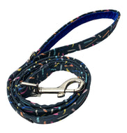 Confetti print dog lead with vibrant blue velvet handle lining. Made in the UK and washable.