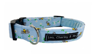 Handmade pale blue dog collar printed with bees .