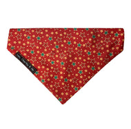 Christmas Star print dog bandana in red with red green and gold stars. Hand made in the UK and washable.