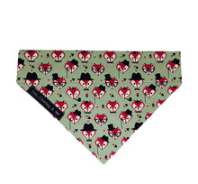 Fabric dog bandana in sage green printed with foxy faces. 