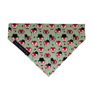 Fabric dog bandana in sage green printed with foxy faces.