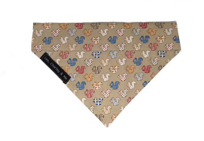 Handmade Squirrel print dog bandana on coffee coloured fabric made in the UK and washable