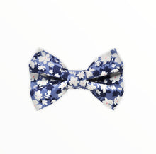 Handmade dog bow tie in cotton print. Made by hand in the U.K. and washable. Denim shades of blue with cream floral print 