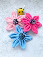 Handmade felt collar flowers with a rainbow leopard print centre button. Made in the U.K.