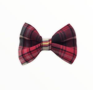 Handmade dog bow tie in cotton print. Made by hand in the U.K. and washable. Red tartan cotton and wool mix dog bow tie. Perfect for Christmas. 