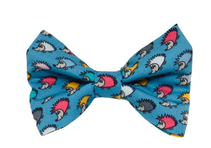 Dog bow tie in turquoise cotton hedgehog print fabric. Covered in multicoloured tiny hedgehogs. Handmade in the U.K. 