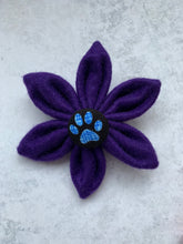 Handmade felt dog collar flower in purple with a paw print central button. Made in the UK 
