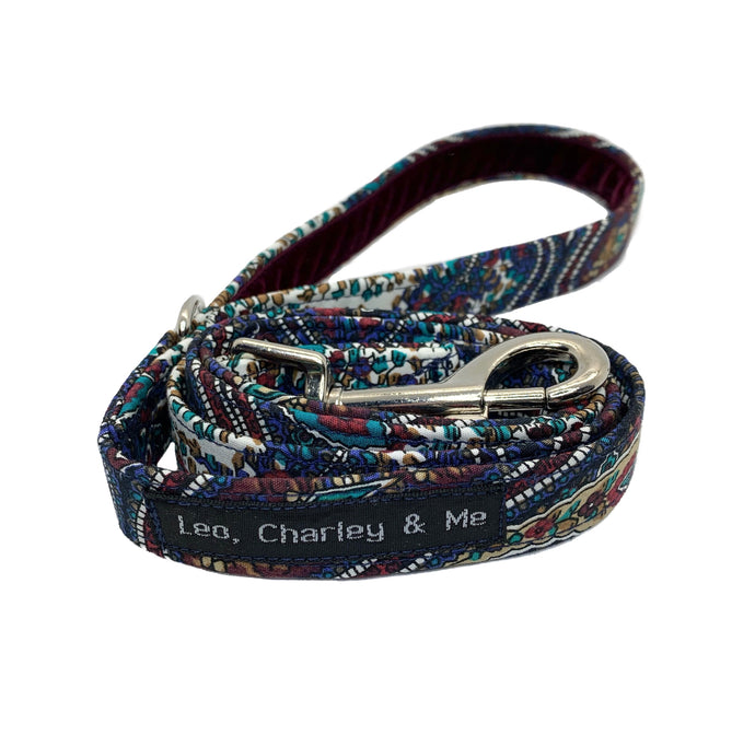 Paisley print dog lead with a navy blue velvet lined handle. Made in the UK and washable.
