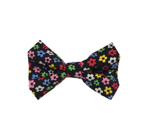 Black cotton fabric dog bow tie printed with multicoloured flowers.  Washable and handmade in the U.K.  