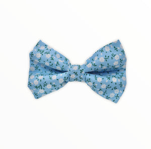 Handmade dog bow tie in cotton print. Made by hand in the U.K. and washable. Blue cotton poplin dog bow tie with teeny tiny white floral print 