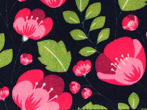 Soft cotton poplin dog bandana with pink fuchsias and green foliage on a navy background. Hand made in the U.K. and washable.