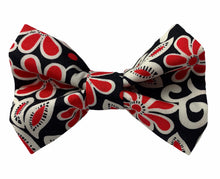 Handmade dog bow tie in cotton print. Made by hand in the U.K. and washable. Black cream and red swirly floral print