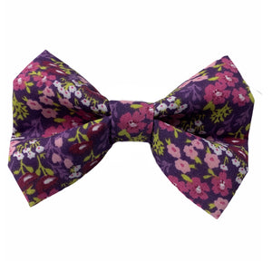 Handmade dog bow in a pretty purple floral print. Made in the UK and washable.