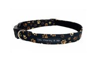 Soft handmade cotton poplin dog collar with muddy paw prints. Made in the UK and washable